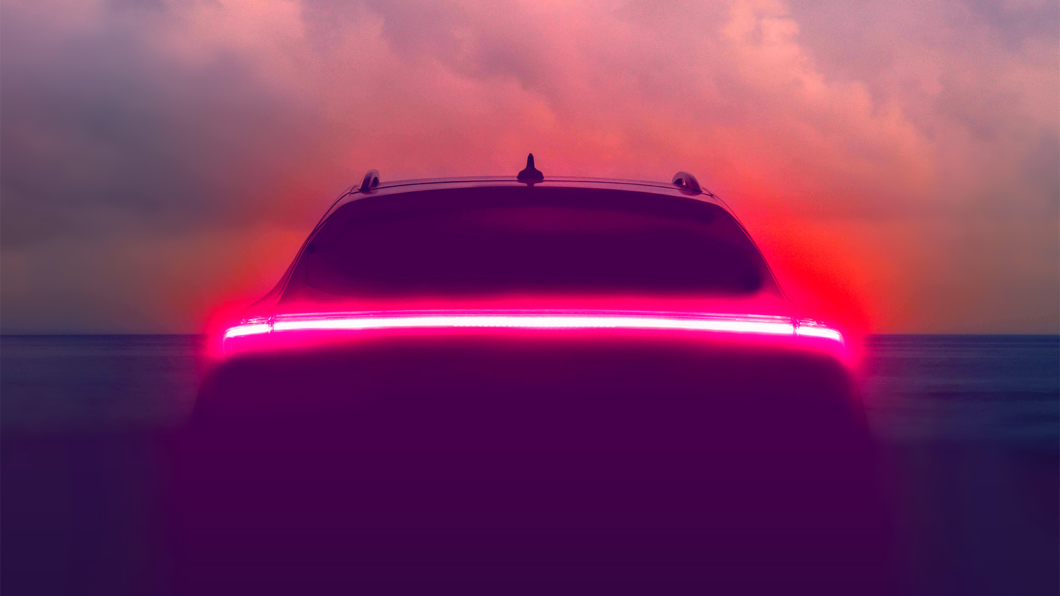 Brake lights glowing on an autonomous vehicle with a hazy blue sky in the background