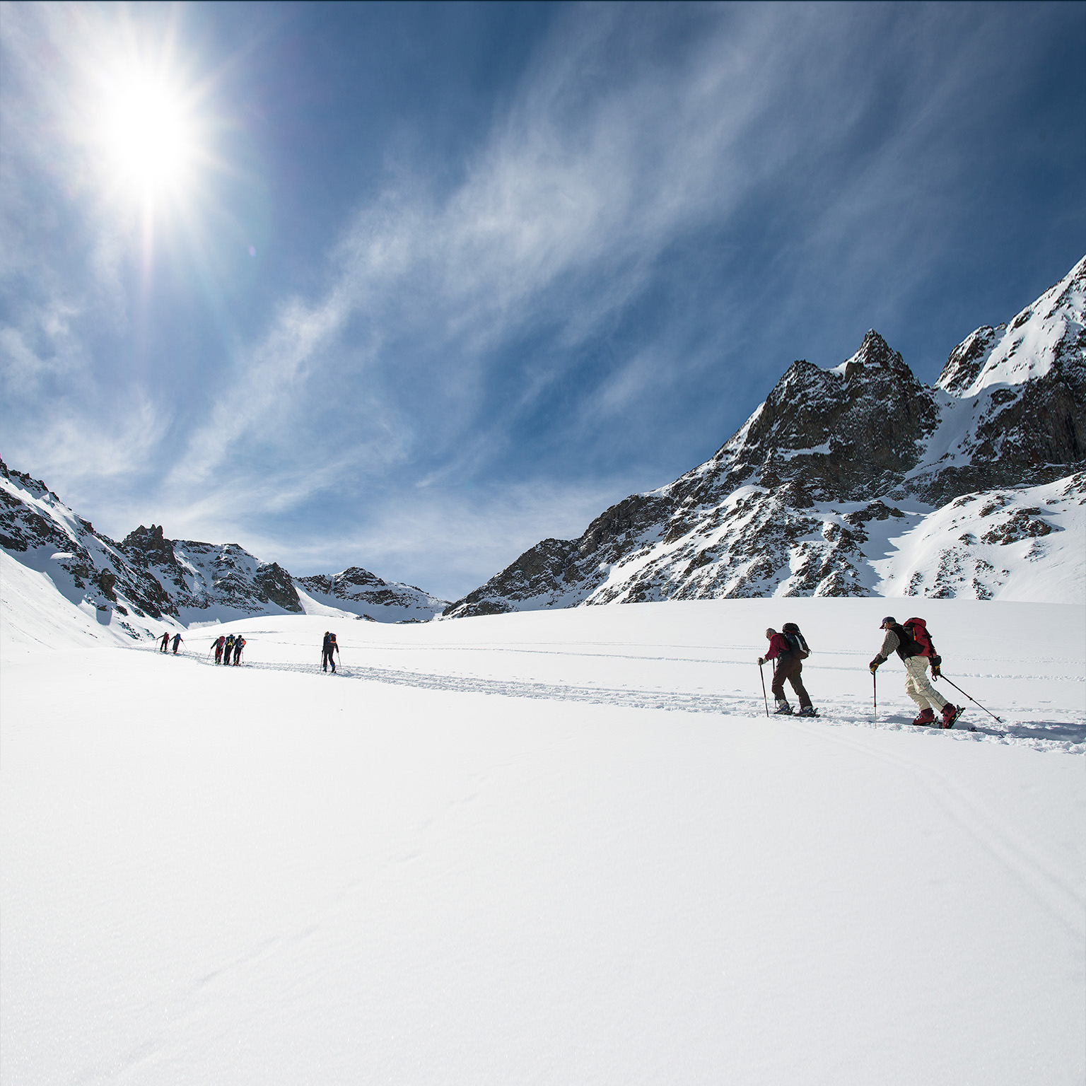 Group of ski mountaineers during a trip on the alps - stock photo