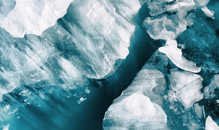 Small icebergs broken off from the large glacier at Vatnajökull, Iceland. Image was taken with a drone.