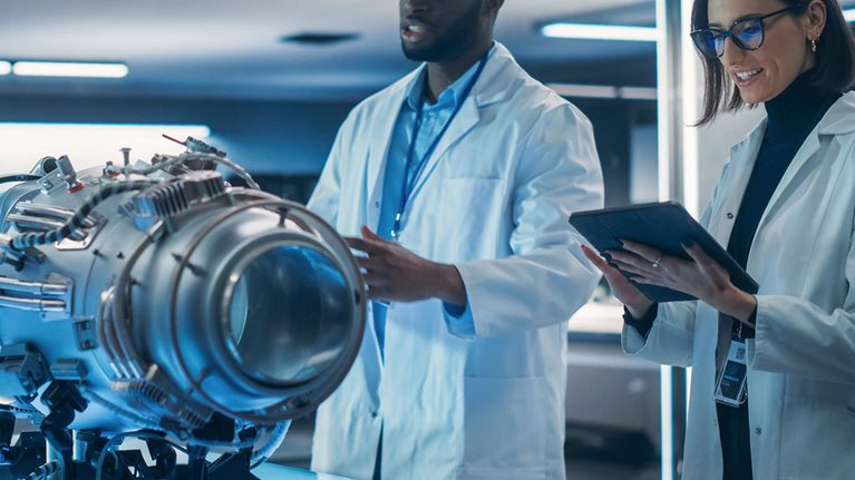 Portrait of a Young Team of Multicultural Engineers with Tablet and Laptop Computers