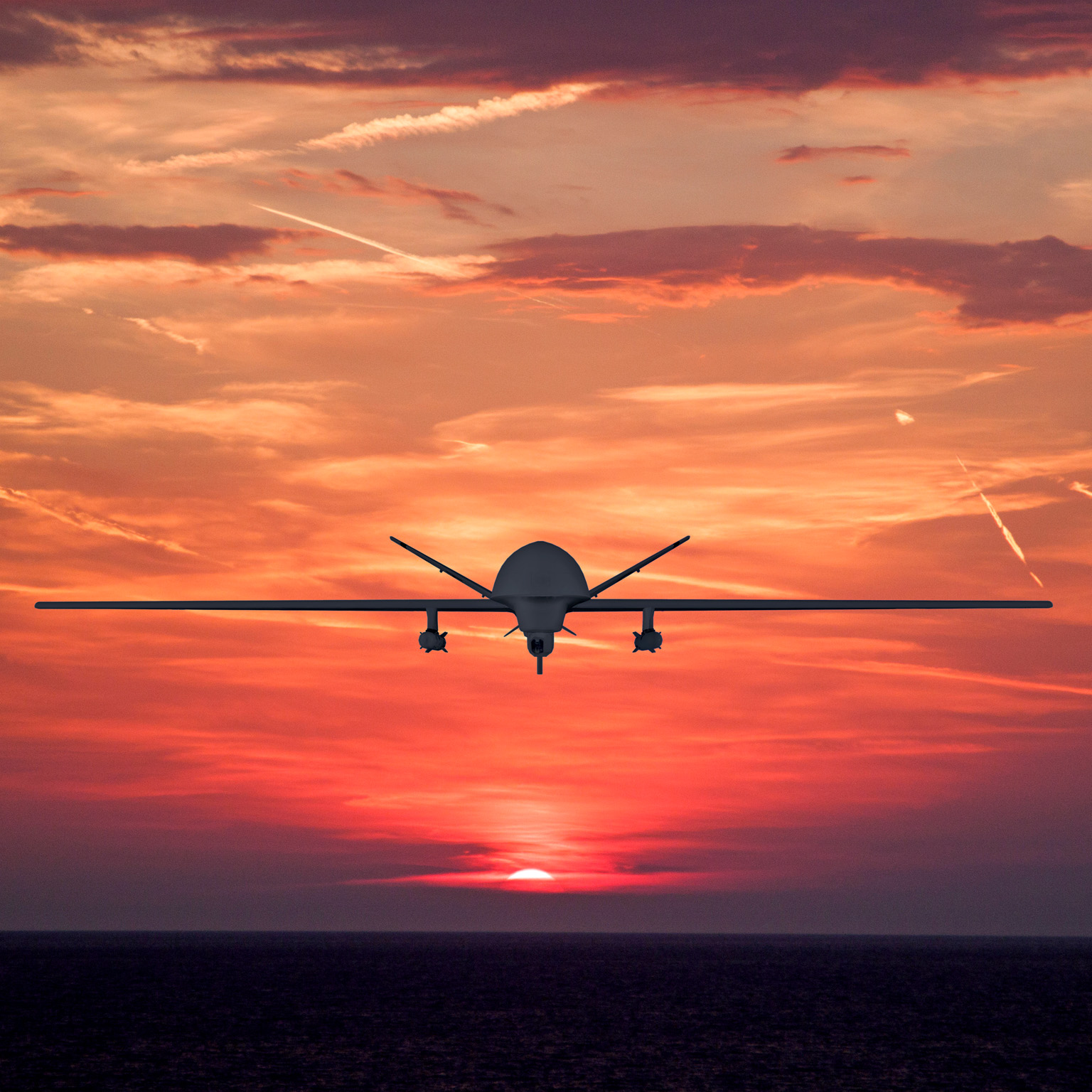 Plane flying at sunset