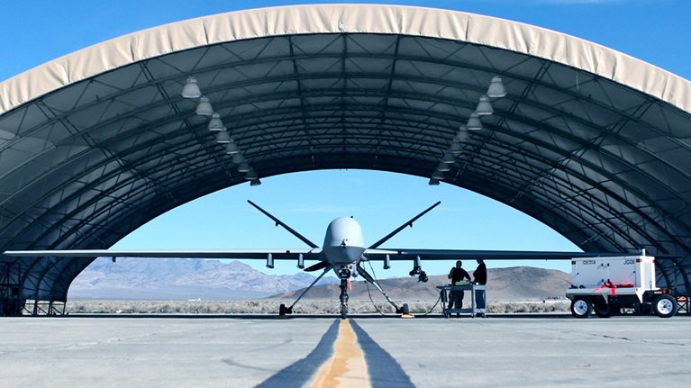 A defense aircraft in its hangar