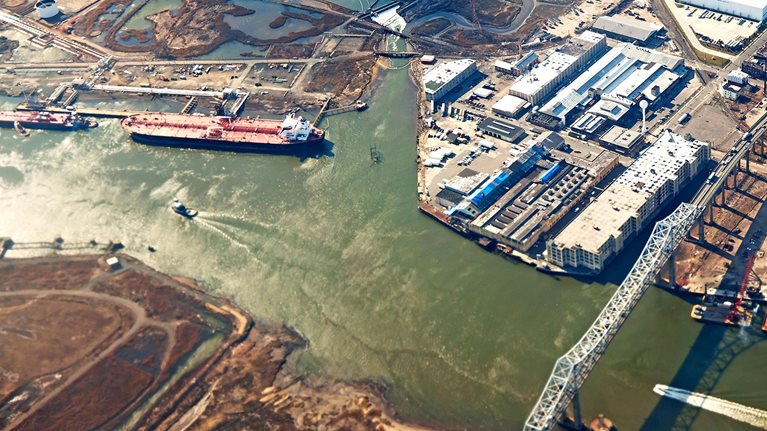 Aerial view of urban landscape with river and industry