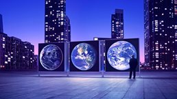 Illuminated cityscape with man looking at Earth expo