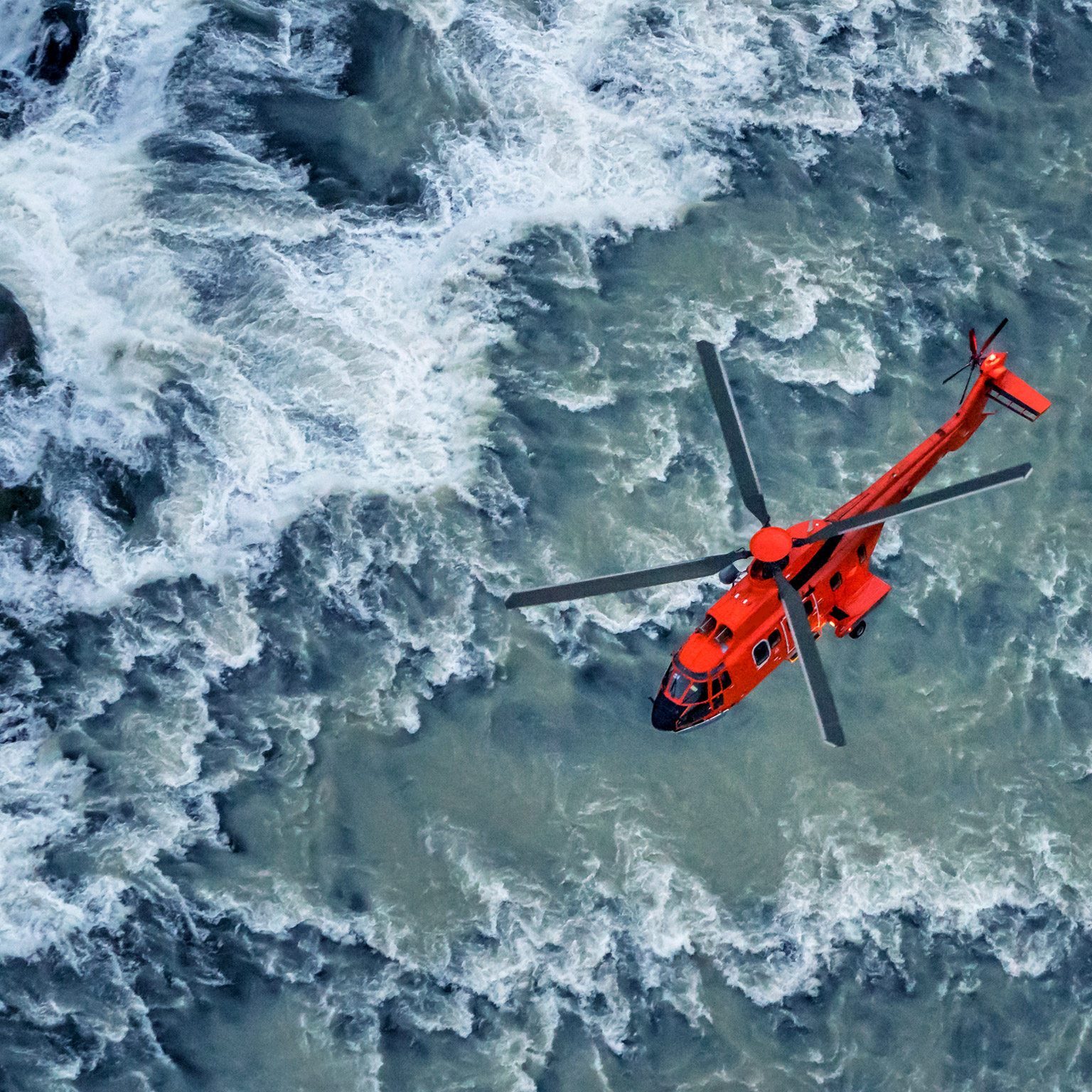 Helicopter over water