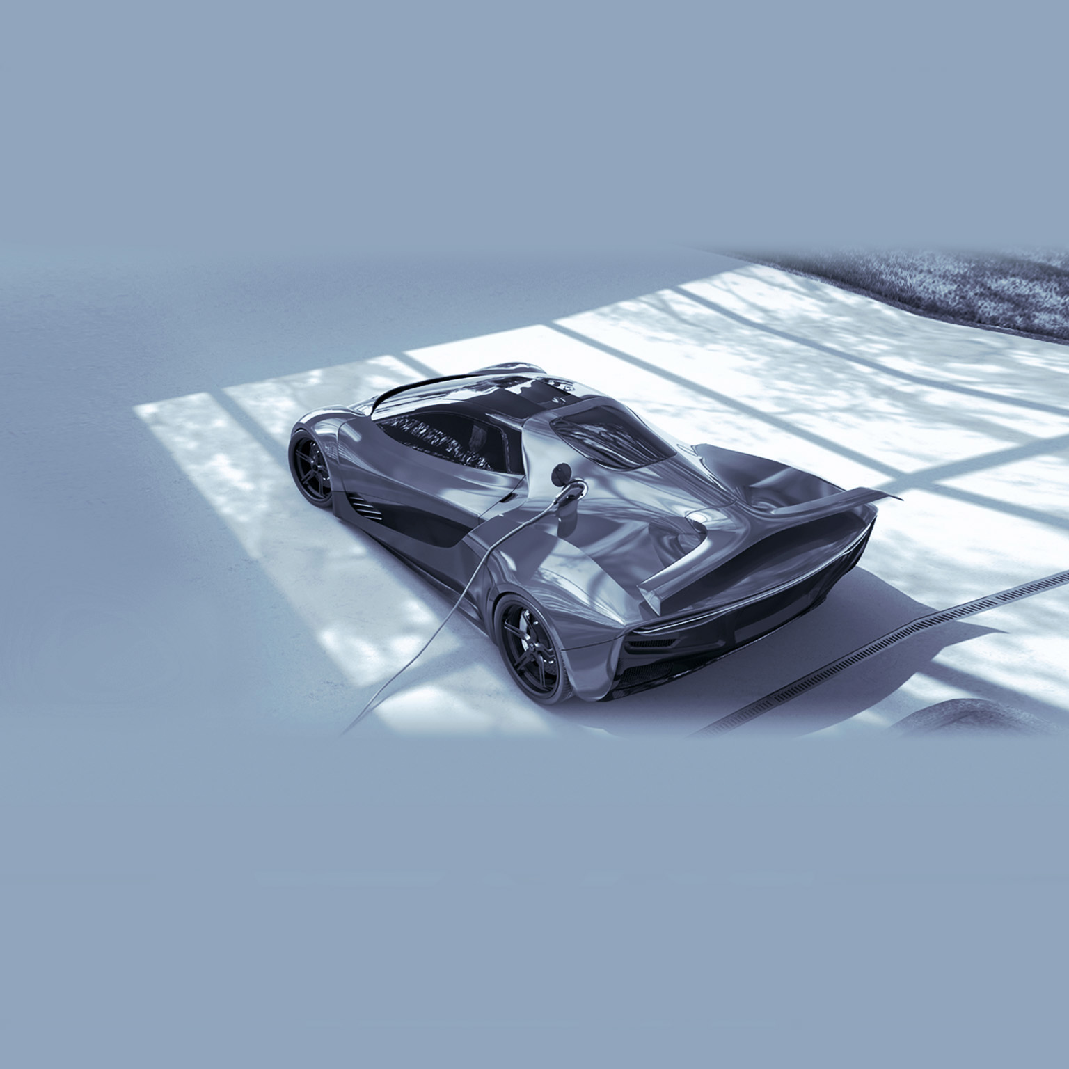 Electric Sports Car Plugged Into Electric Charger On Driveway - stock photo