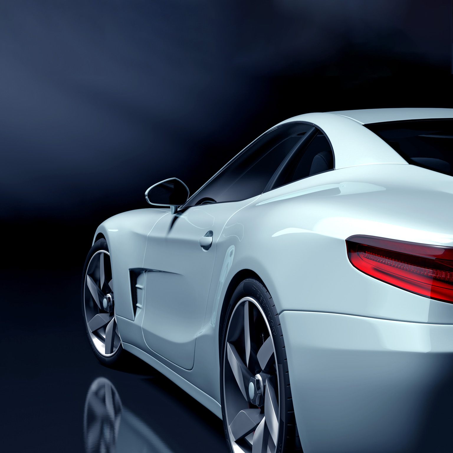 White sport car in a dark showroom