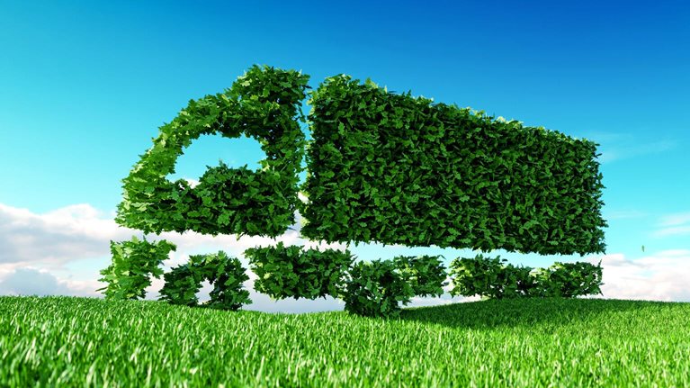 3D rendering of green green truck icon on fresh spring meadow with blue sky in background.