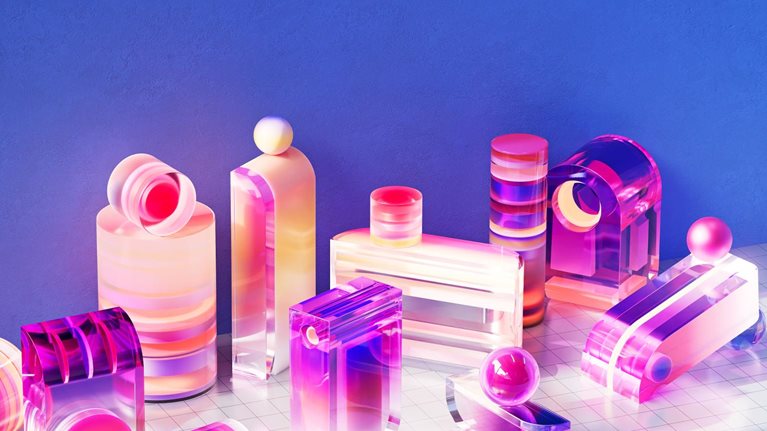 A collection of translucent, geometric shapes in vibrant pink and purple hues are arranged on a white grid. The colorful composition evokes a sense of modern design and abstract beauty products.