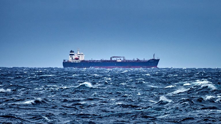 Ship delivering cargo in the stormy Mediterranean sea