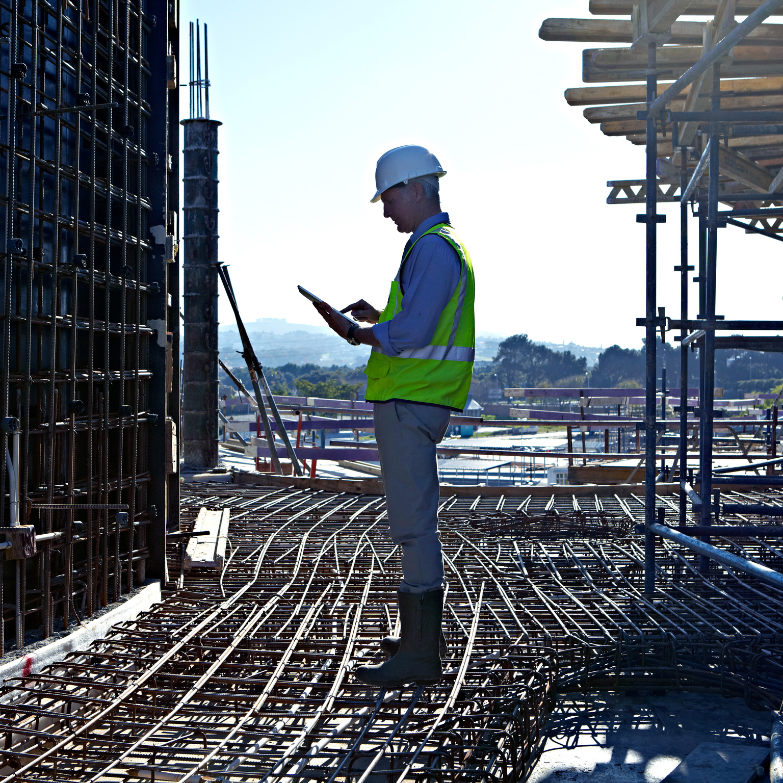Worker man standing at a construction site