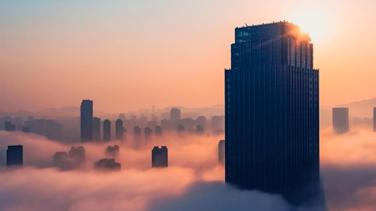 Aerial view of office building in cloud. - stock photo