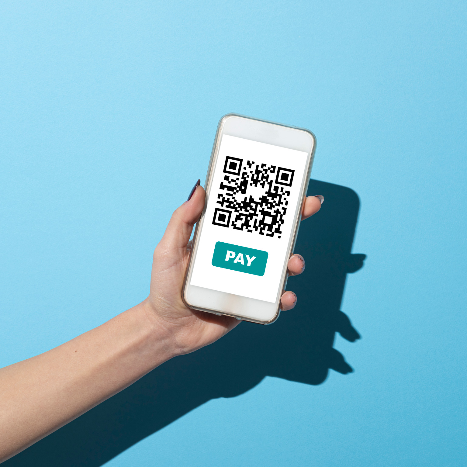Woman with the QR code for payment on her smart phone