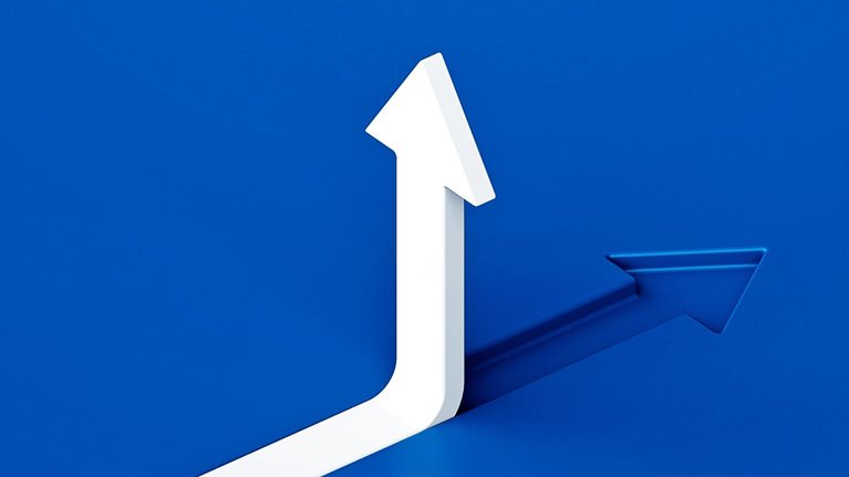 White arrow sloping upward in a blue background merging with a blue arrowhead