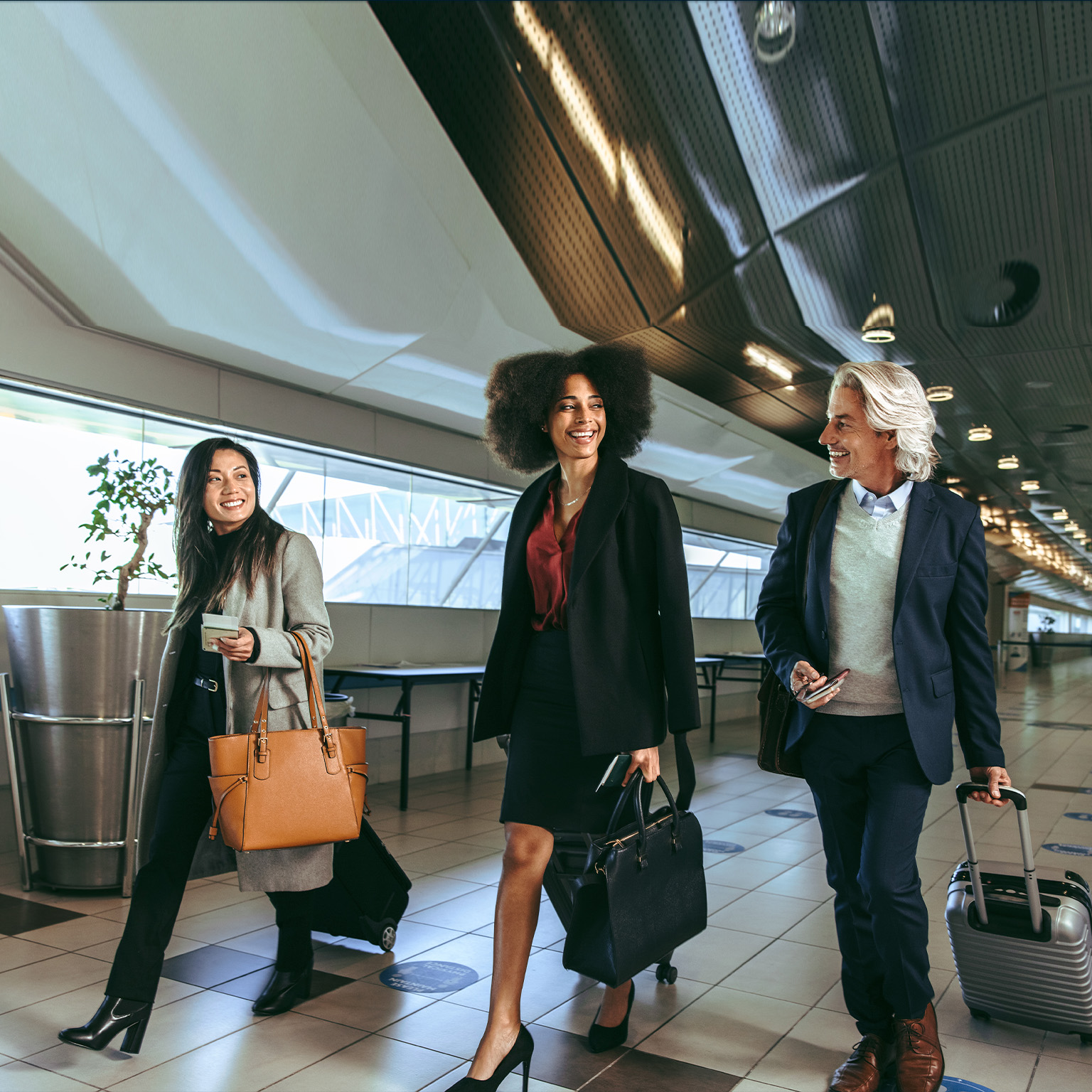 Multi ethnic people going on business trip - stock photo