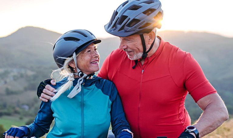 Portrait of senior couple on a bike ride in nature.