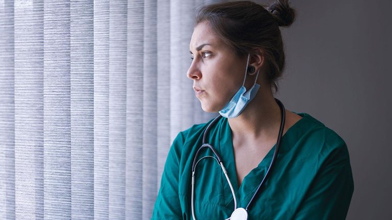 Young female healthcare person tired from the long working day