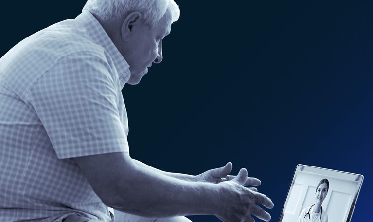 Senior man using laptop.