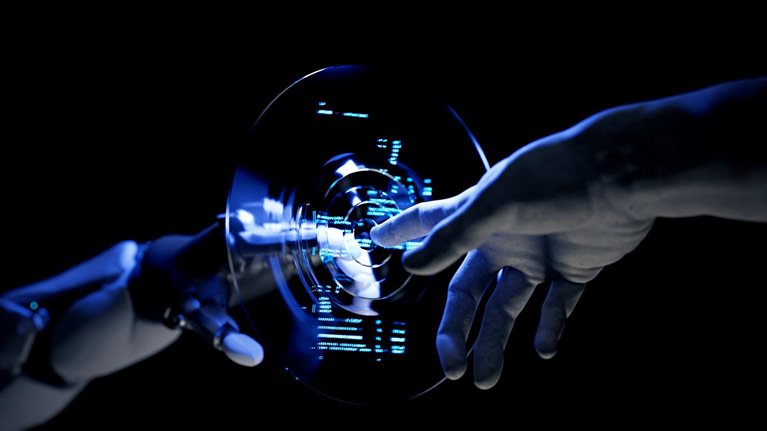 A human hand and a robotic hand extend their index fingers toward each other, separated by a circular and transparent interface. The interface displays a blue code that appears to radiate outward as the two hands move closer.