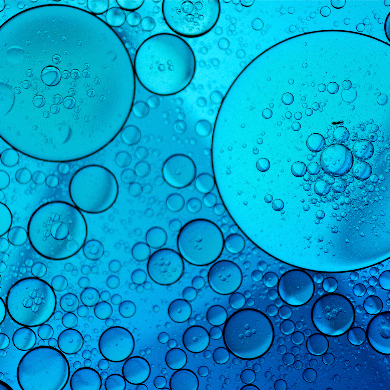 Blue abstract background with oil and water - stock photo