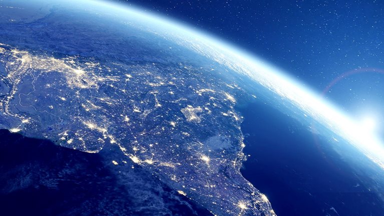 Image of India at night viewed from space with city lights illuminating the country.