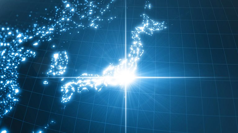 Power of Japan, energy beam on Tokyo. dark globe with illuminated cities and human density areas.