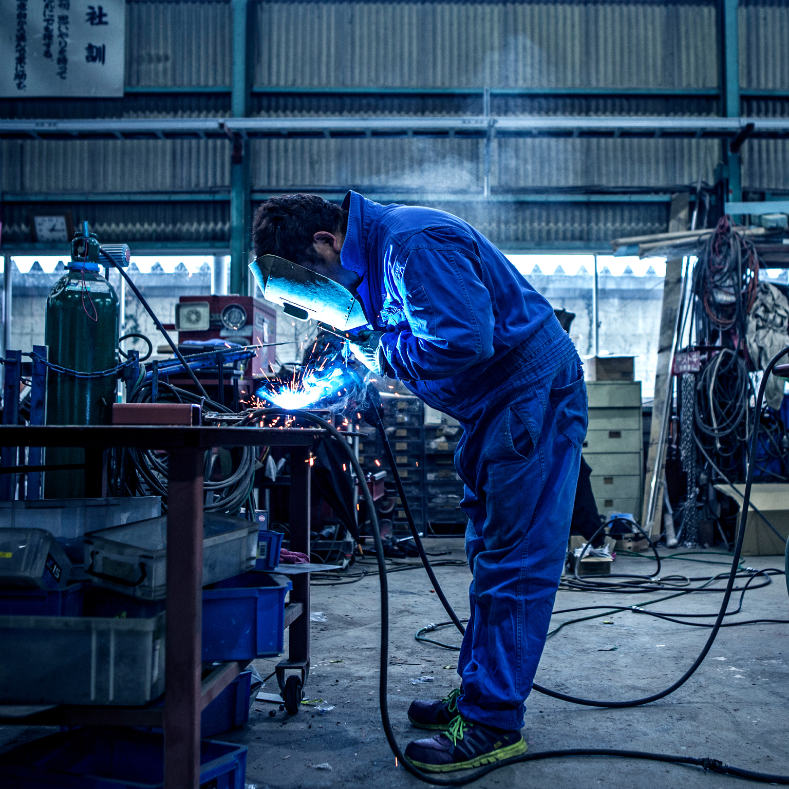 A man in blue overalls