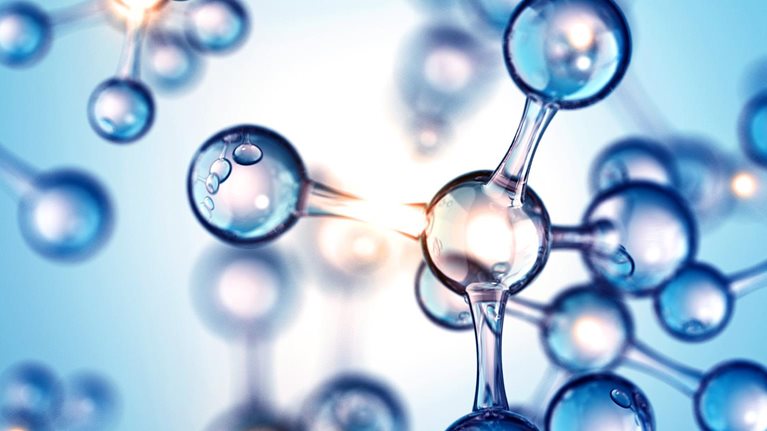 3d image of molecular structures lit from behind over a blue background.