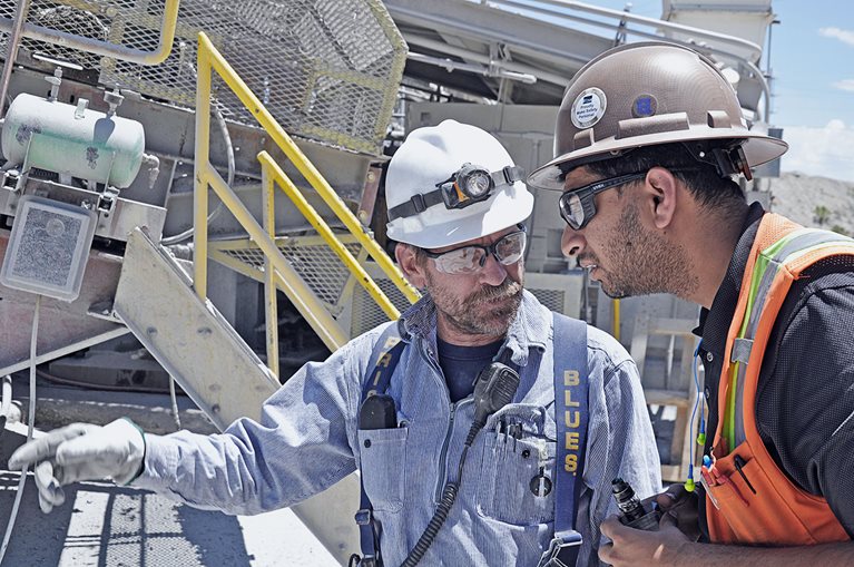 Mill operator II Floyd (George) Mocaby and senior metallurgist Rahul Singh review the alarms on the gantry system.