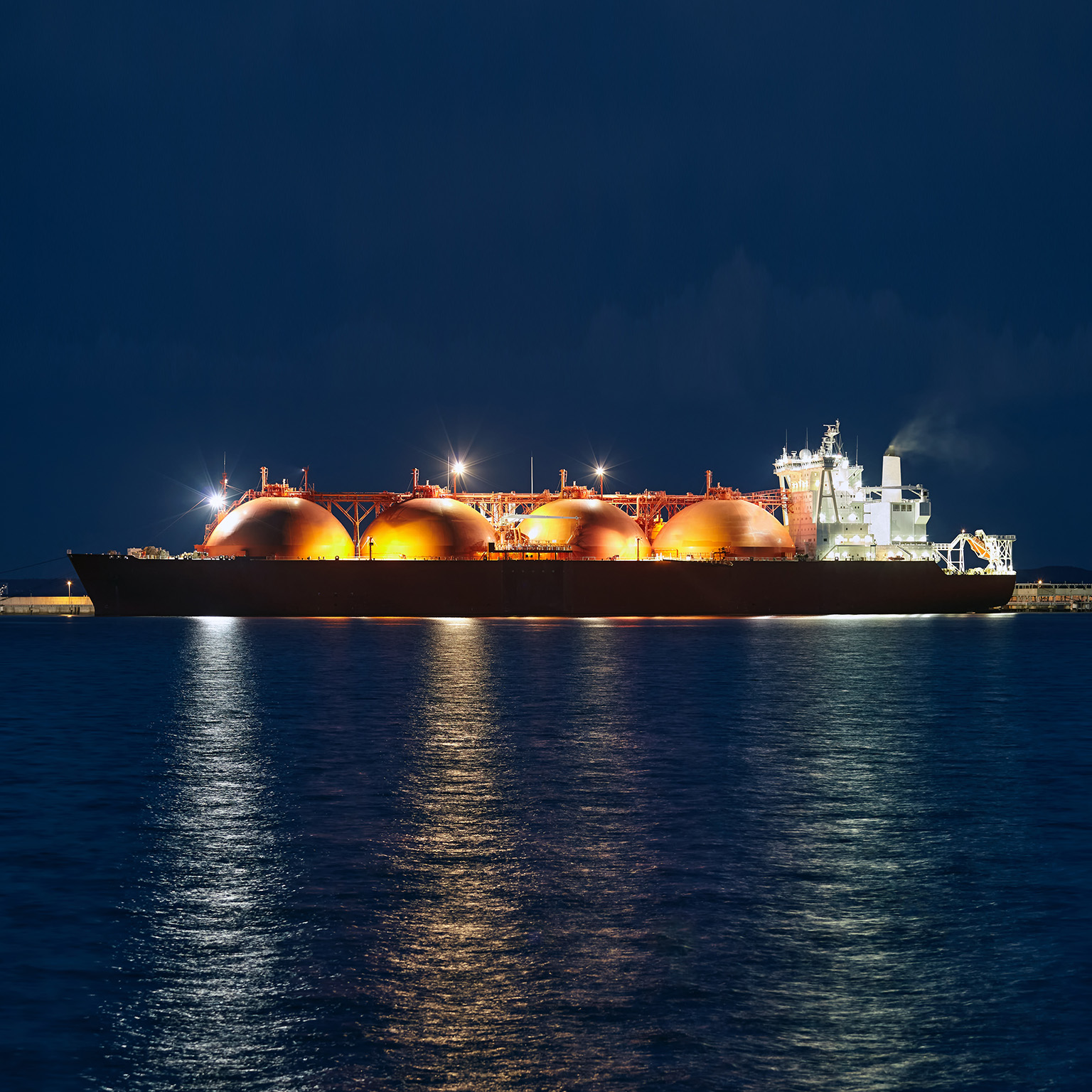 Picture of LNG tanker in port at night. - stock photo