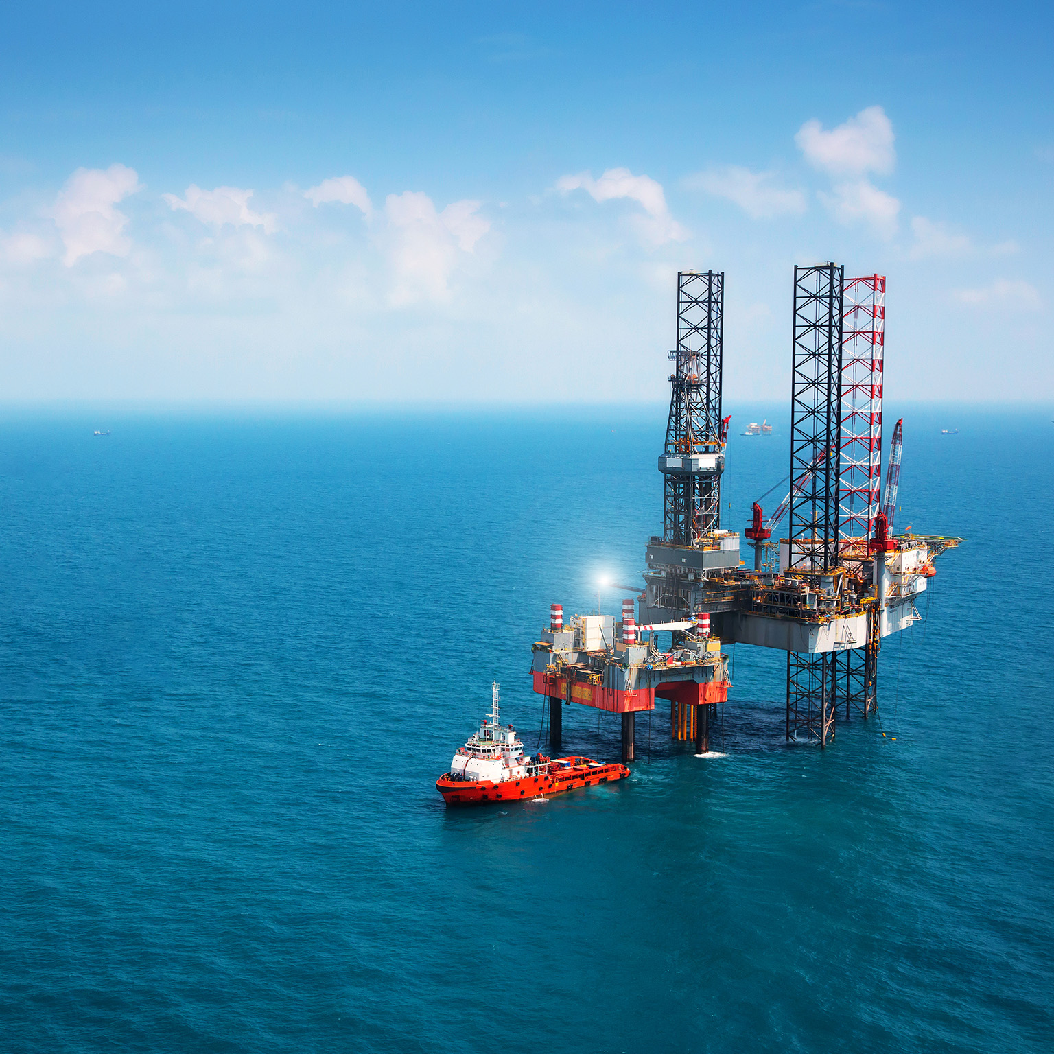 Oil platform in middle of ocean - stock photo