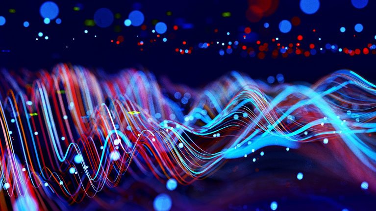 Digital generated image of abstract flowing data made out of numbers and glowing blue and red splines moving away from camera on black background.