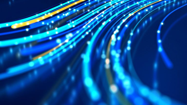 Close up of network data flowing on black background