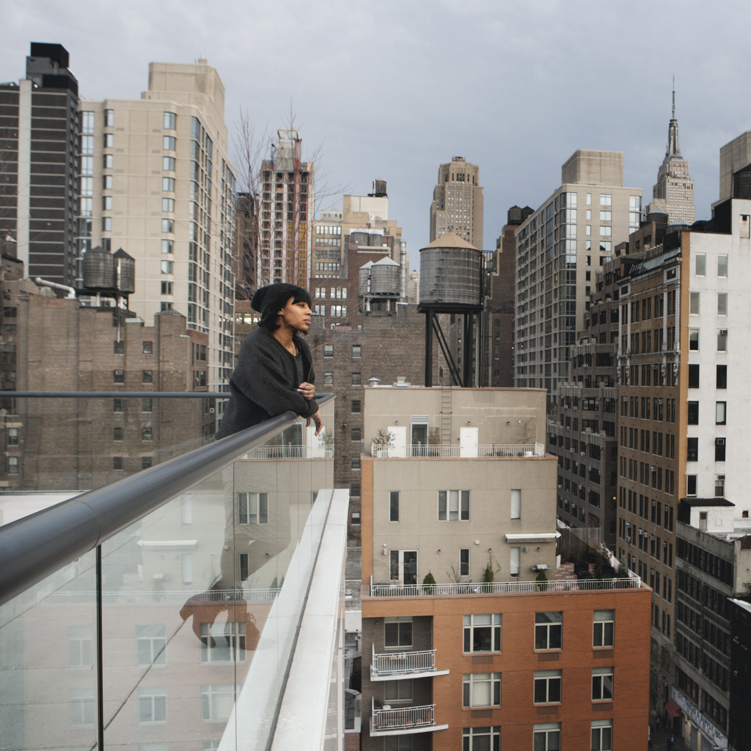 Woman looking out to cityscape