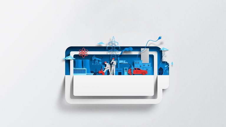 A white sheet of paper has been cut and folded in half, creating the silhouette of a battery symbol. Inside of the battery are vibrant blue and red-colored shapes representing  various energy sources and infrastructure, including a nuclear power plant, power lines, and an electric vehicle charging station.