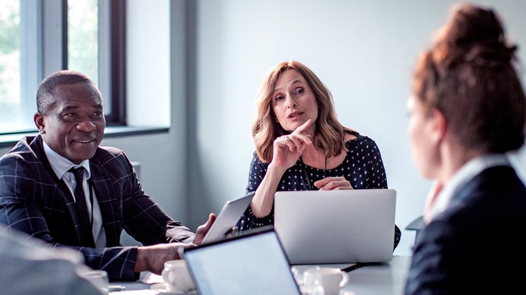 A group of business people having a meeting in a conference room