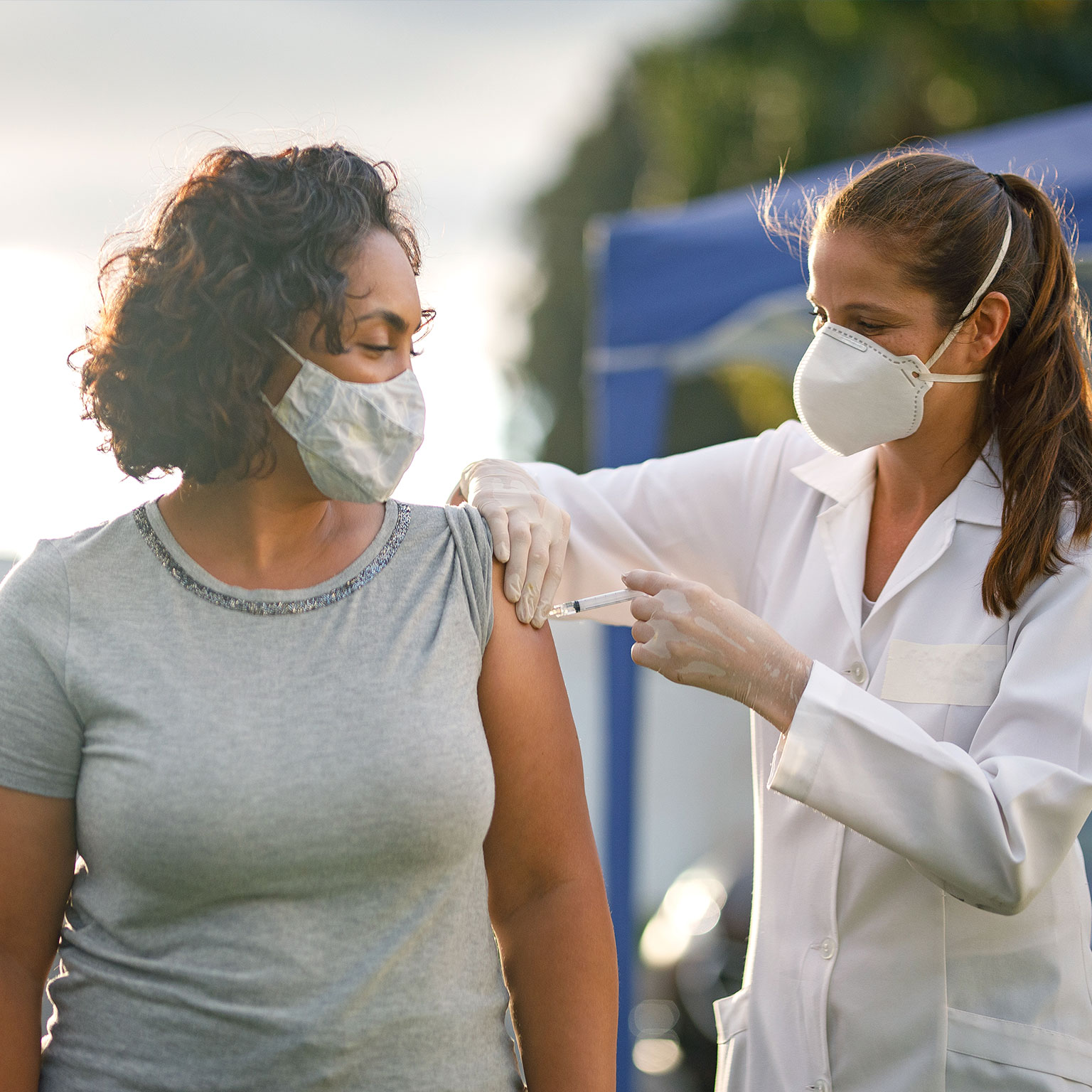 A patient receiving an injection from a nurse