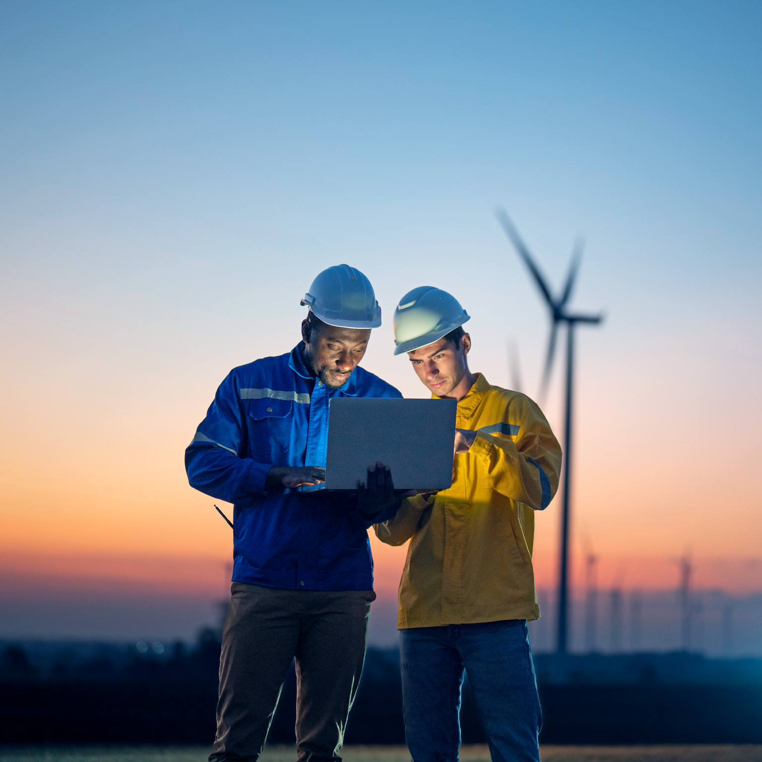 Maintenance engineer team working on wind turbine farm