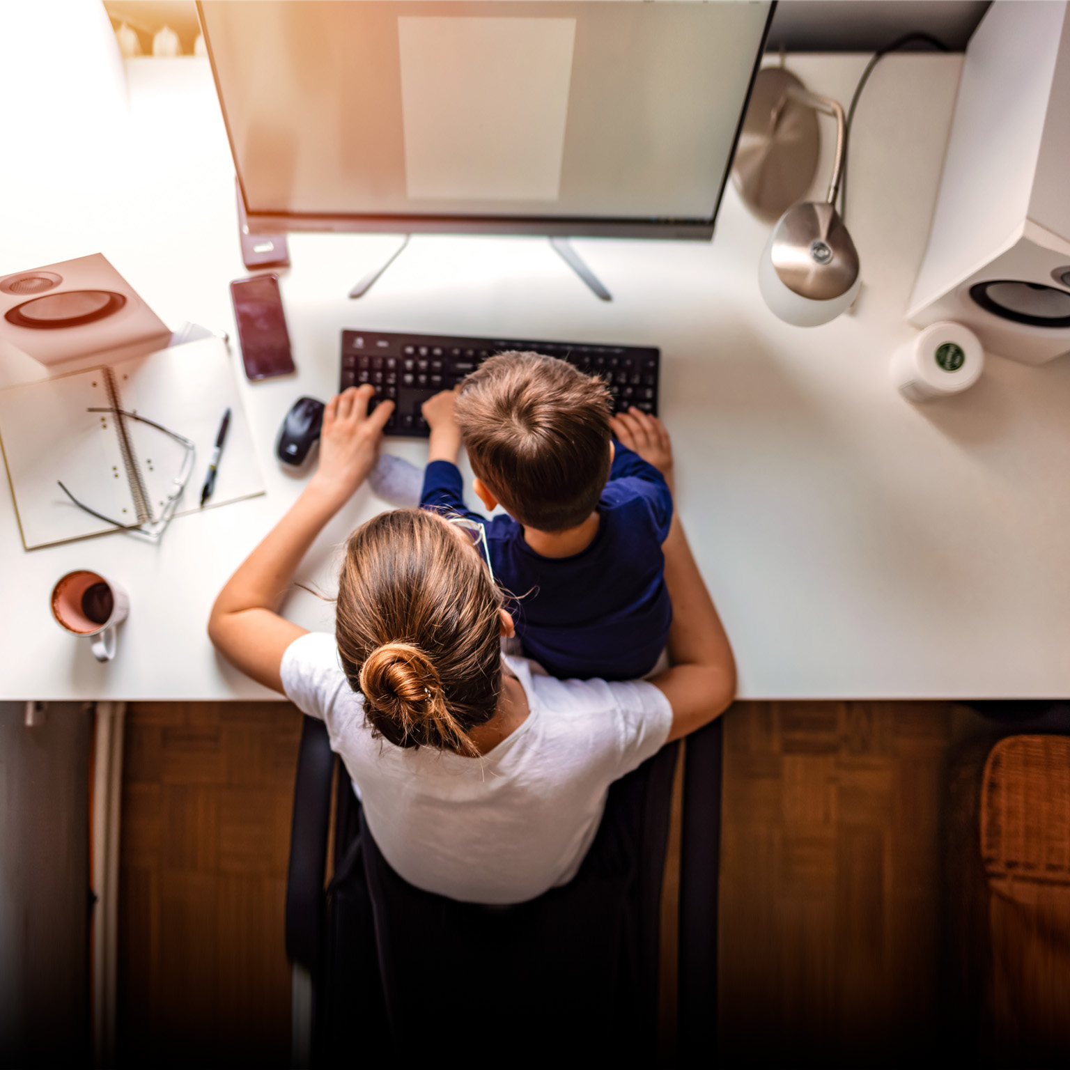Young mother working from home - stock photo