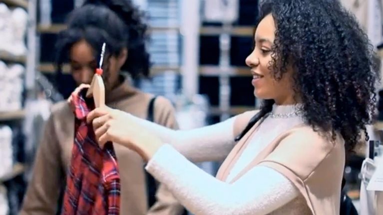 Two women shopping in a department store