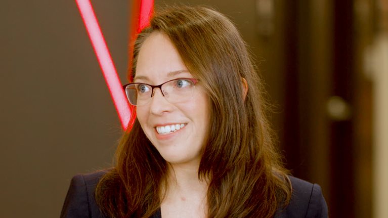 A still image of Ashley Fenn being interviewed.