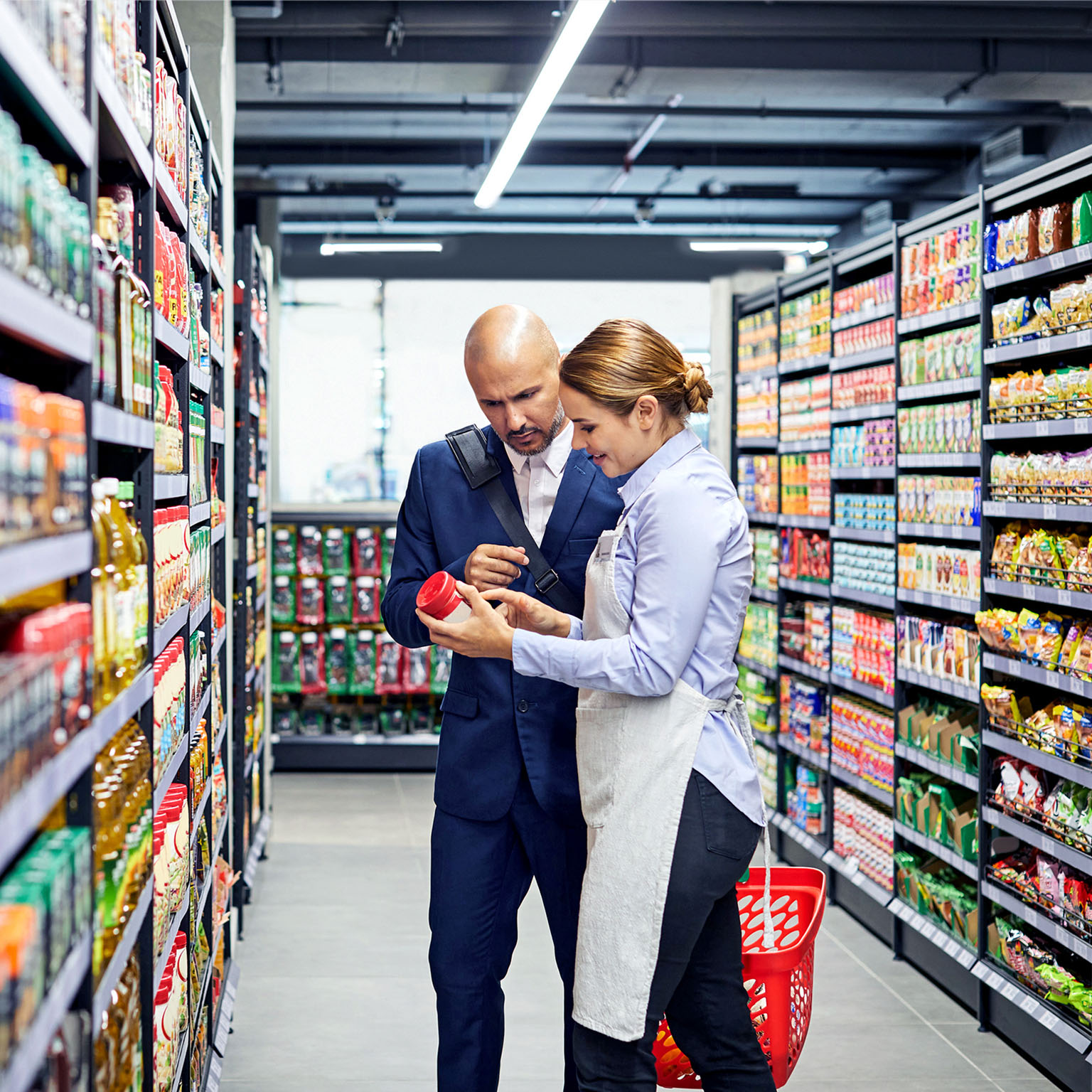 Store worker helping a customer in a supermarket