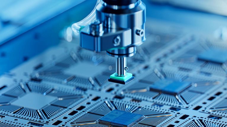 Close-up of silicon die being extracted from a semiconductor wafer