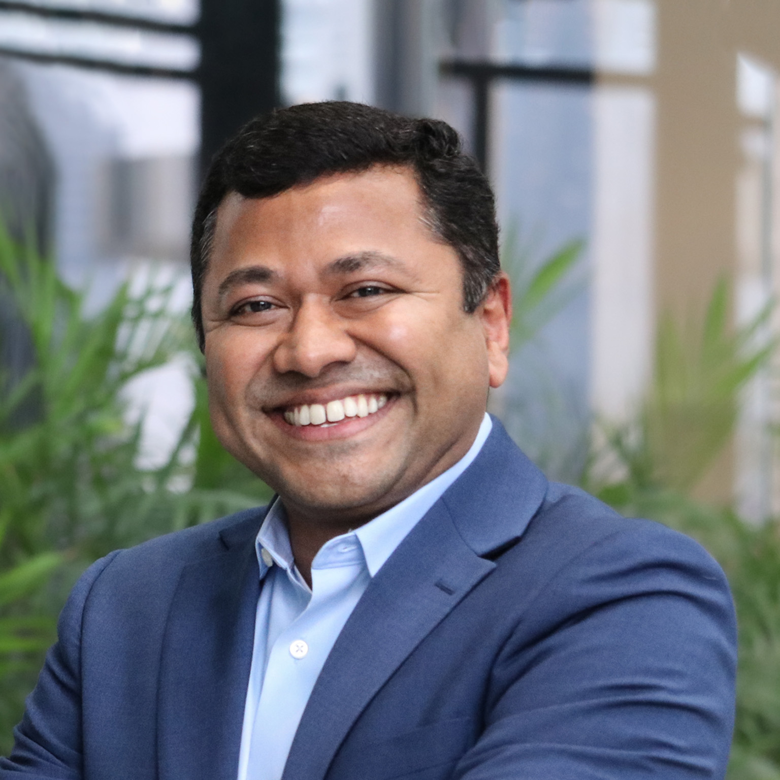 A smiling portrait of Matt Elenjickal