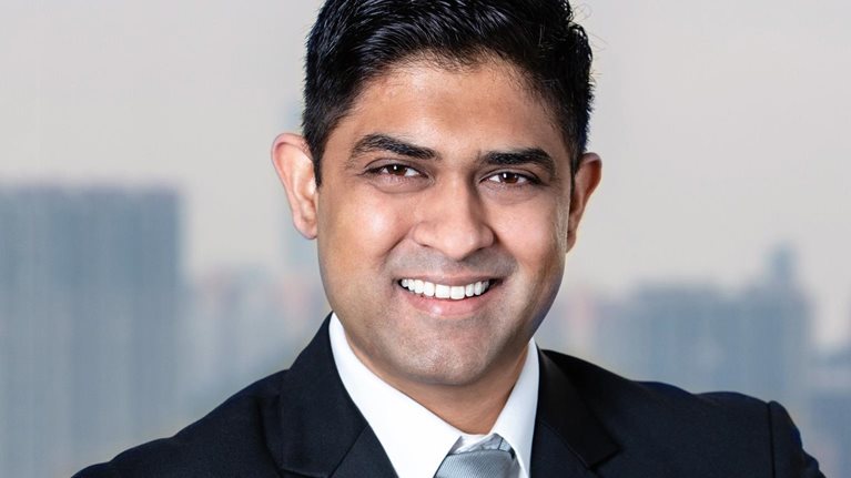 A smiling portrait of Akhil Nair