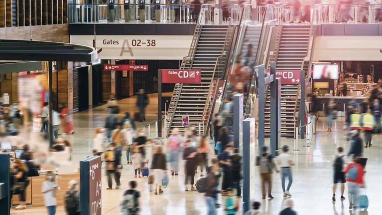 Airport hall with travelers