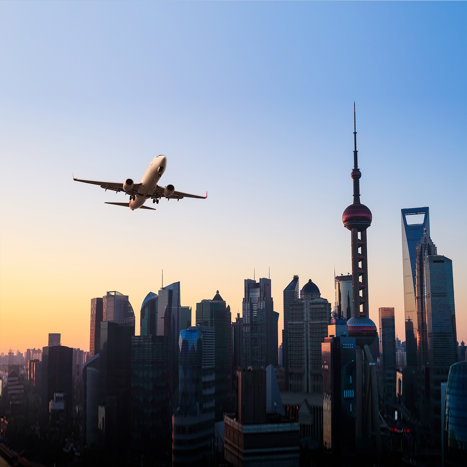 Modern city skyline with airplane - stock photo