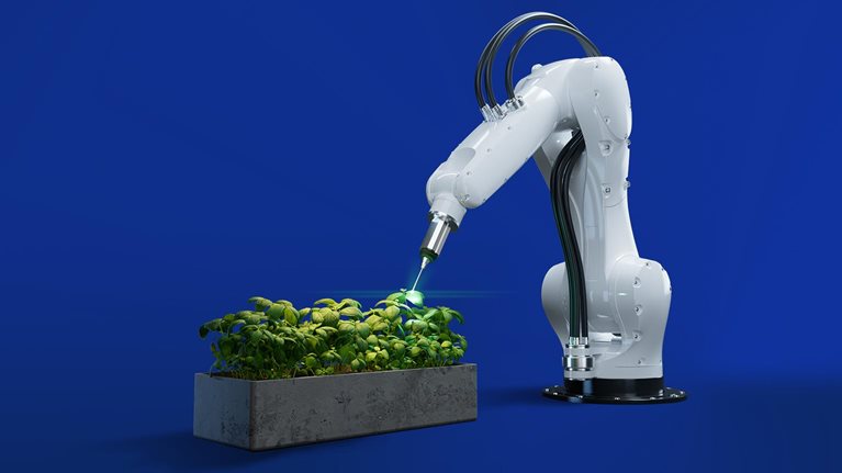 robotic arm tending to plants - image