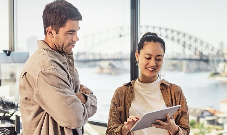 A diverse team of Australian professionals collaborating in a Sydney office.