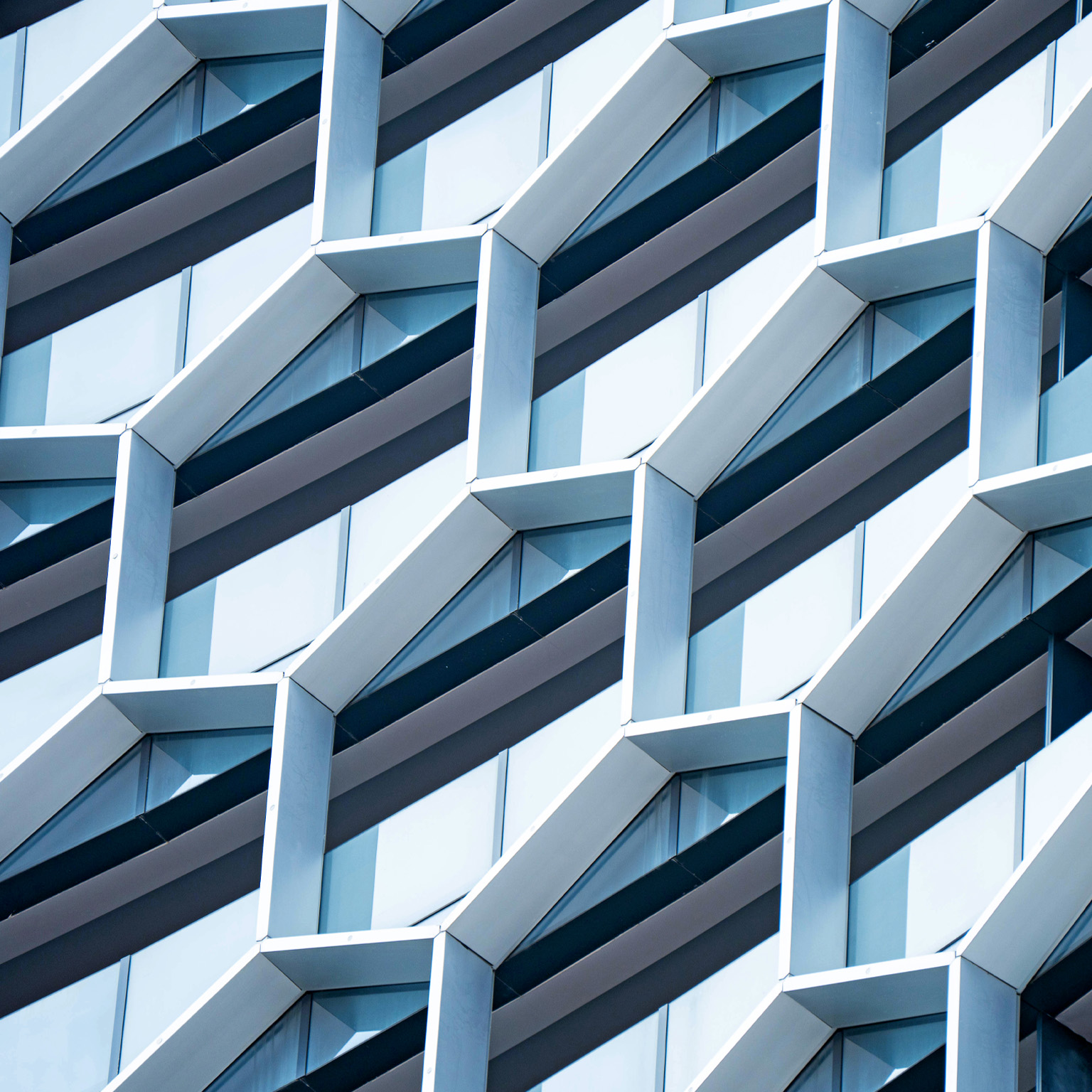 Detail of hexagon shaped windows on a modern office building.